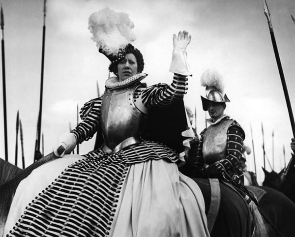 Fire Over England (1937) - Flora Robson - stripe gown w/armor