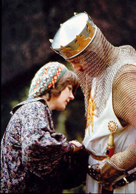 Designer Hazel Pethig adjusts Graham Chapman's costume on Monty Python and the Holy Grail