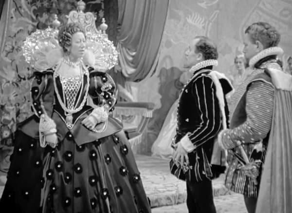 Fire Over England (1937) - Flora Robson - dots gown -Leslie Banks
