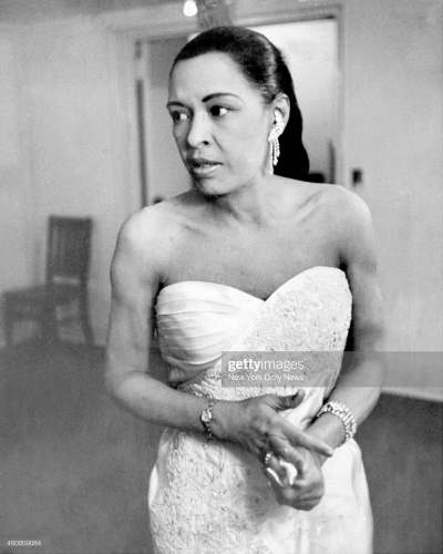 Billie Holiday backstage at Town Hall at her last major jazz concert before she became ill. Acknowledged to be one of the greatest jazz singers, Lady Day, as she was called, worked with Count Basie, Teddy Wilson, Artie Shaw and Benny Goodman. But Holiday's life was tragic, marred by drugs, and ended in 1959 at the age of 44. (Photo By: /NY Daily News via Getty Images)